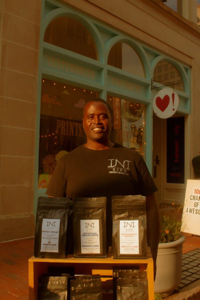 INI Sips representative selling tea in front of Hartford Prints!