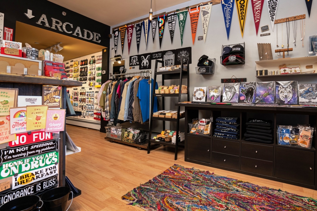 The inside of the Strange Ways store in New Haven with pendants, clothes, stickers and accessories.