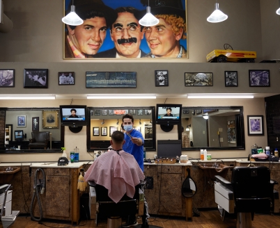 A man getting his hair cut at the Professional Barber Shop